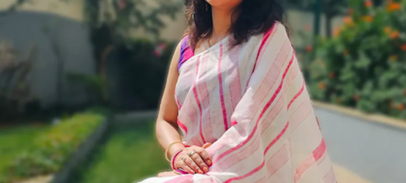 The-Power-Drape-Why-Off-White-Cotton-is-the-New-Standard-for-Formal-Wear-Sarees-beauty-and-fashion-freaks-pink-in-white-base-linen-saree-1