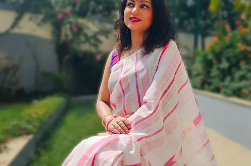 The-Power-Drape-Why-Off-White-Cotton-is-the-New-Standard-for-Formal-Wear-Sarees-beauty-and-fashion-freaks-pink-in-white-base-linen-saree-1